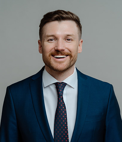 happy-professional-businessman-in-suit-smiling-at--3DKGHB9