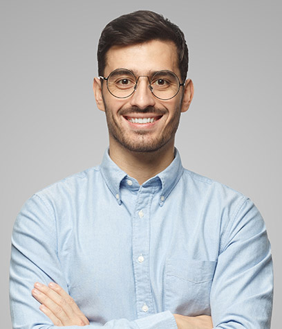 successful-young-businessman-standing-with-crossed-RGT9RF4