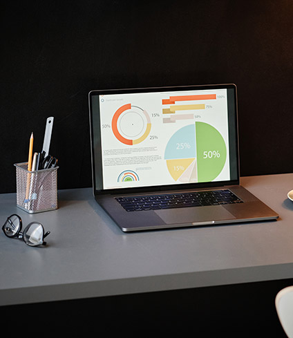 laptop-with-charts-on-the-table-QV7DZ9L.jpg