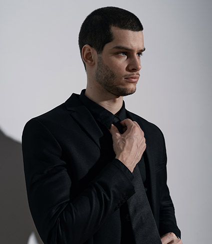 young-handsome-businessman-in-black-shirt-and-blac-2J4CSL6.jpg